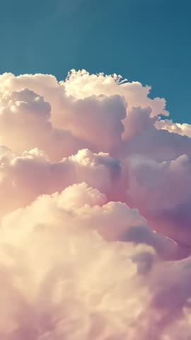 Vertical Time-Lapse Showing Sunrise Light Illuminating Towering Cumulus Clouds at Golden Hour