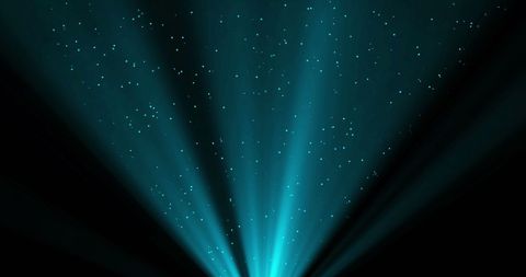 Dazzling Light Rays with Falling Confetti on Black Background - Download Free Stock Images Pikwizard.com