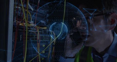 Engineer wearing safety vest inspecting server cables with digital overlay