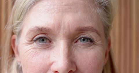 Close-Up of Mature Woman's Face Emphasizing Natural Beauty