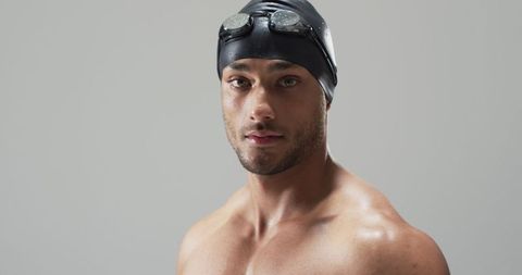 Determined Young Swimmer Wearing Goggles Ready for Competition