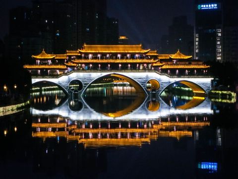 Night View of Illuminated Ancient Chinese Bridge Reflecting on River - Download Free Stock Images Pikwizard.com