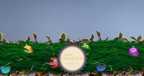 Merry Christmas Banner with Festive Ornaments and Greenery