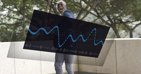 Laughing senior professional using holographic waveform display outdoors, joyful tech