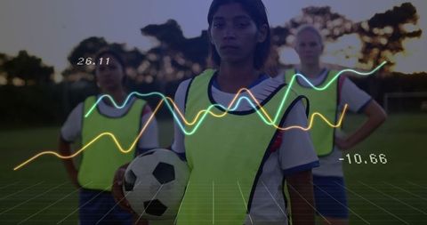 Female Soccer Team Analyzing Performance Data During Outdoor Training