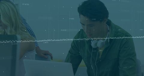 Business Team Analyzing Financial Data with Technology in Office