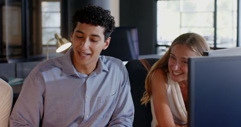 Diverse Workplace Team Collaborating in Late-night Meeting