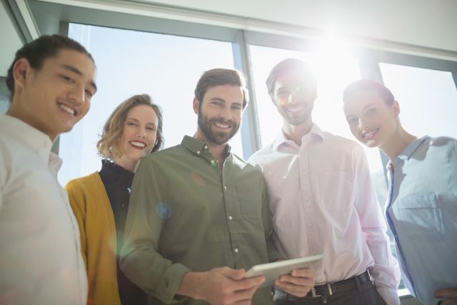 Smiling Business Executives with Digital Tablet in Modern Office - Download Free Stock Images Pikwizard.com