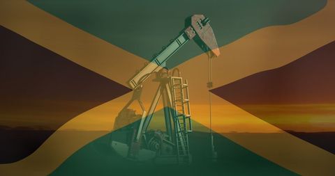 Jamaican flag overlay on oil pump at sunset