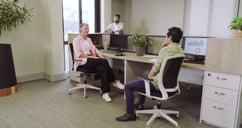 Diverse team engaging in productive office collaboration