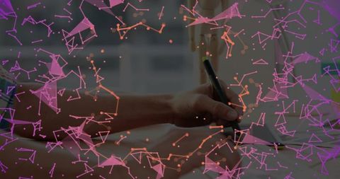 Holding stylus drawing on tablet with purple data network overlay for digital design