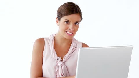 Smiling Woman Using Laptop with White Background