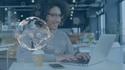 Man Engaging with Global Connectivity Concepts in Modern Café