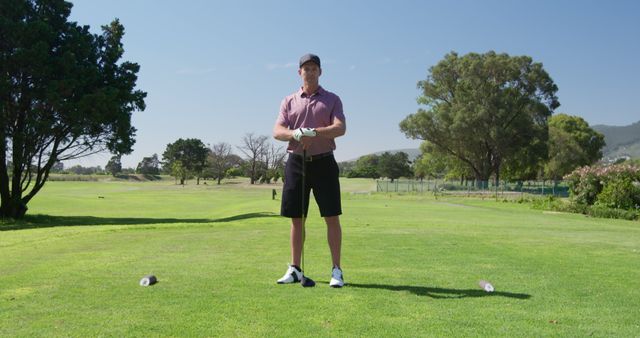 Man Preparing for Golf Swing on Sunny Day - Download Free Stock Images Pikwizard.com