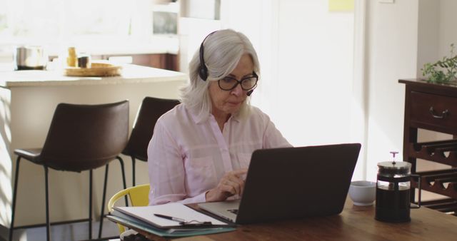 Senior Woman Working from Home on Laptop with Headphones - Download Free Stock Images Pikwizard.com