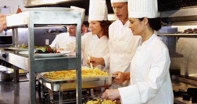 Professional Chefs Preparing Meals in Bustling Kitchen - Download Free Stock Images Pikwizard.com