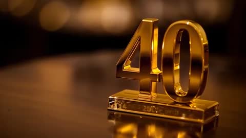 Golden 40 Anniversary Trophy Refocusing and Reflecting With Warm Bokeh Lights