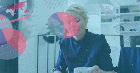 Mature professional studying data overlays holding coffee mug at modern office desk