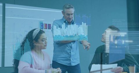 Business Team Analyzing Financial Data with Digital Projections