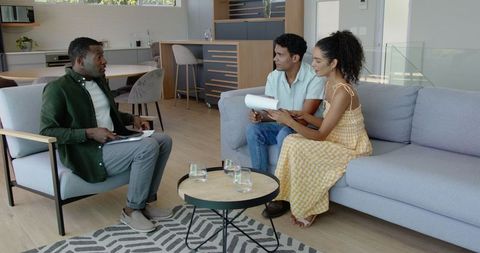 Couple Engaging in Financial Consultation at Home