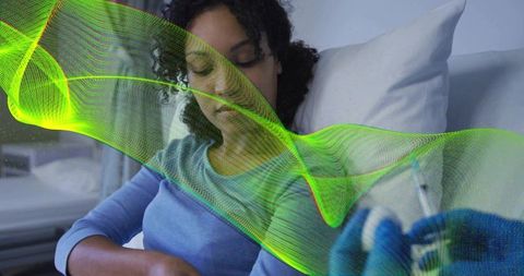 Reclining patient receiving injection in clinic with gloved hand holding syringe and neon health ove