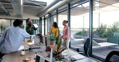 Diverse Team Collaboration in Bright Modern Office Space