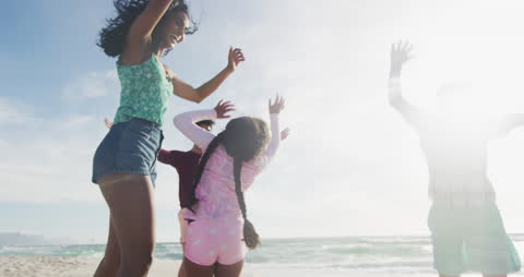Joyful Family Enjoying Beach Activities on a Sunny Day