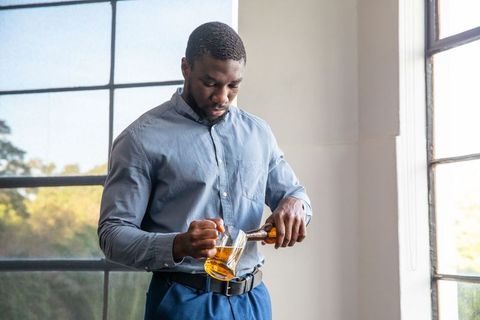 Man Pouring Beverage Feature Home Minimalism Lifestyle