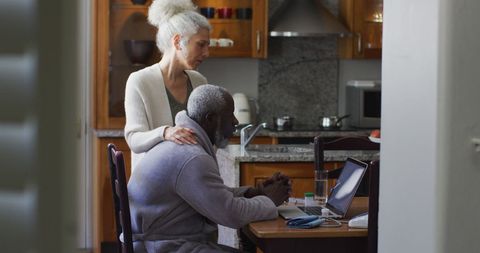 Elderly Couple Video Calling Family from Kitchen