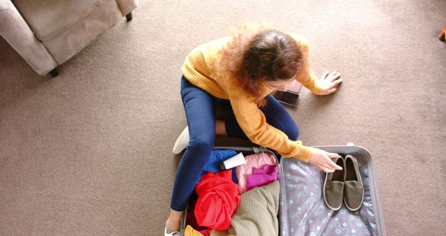 Woman Packing Suitcase Sitting on Floor at Home - Download Free Stock Images Pikwizard.com