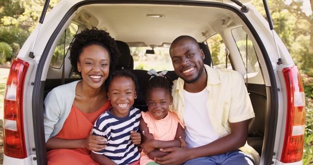 Happy Family Sitting in Car Trunk During Outdoors Getaway - Download Free Stock Images Pikwizard.com