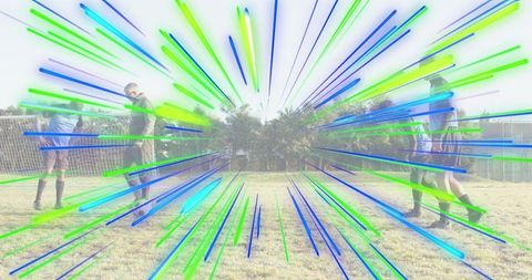 Youth soccer teammates standing on grass field with blue-green motion burst graphic