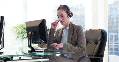 Businesswoman Conducting Customer Service in Bright Office - Download Free Stock Images Pikwizard.com