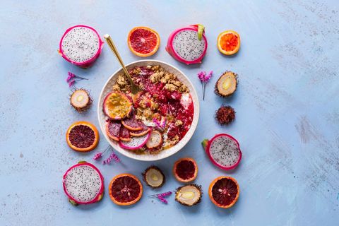 Vibrant tropical smoothie bowl with sliced dragon fruit and exotic fruits