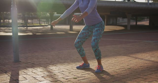 Woman Exercising Outdoors in Sunlight Performing Squats - Download Free Stock Images Pikwizard.com