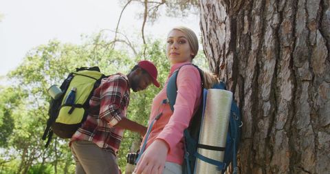 Mixed Race Couple Enjoying Hike in Forest with Backpacks - Download Free Stock Images Pikwizard.com