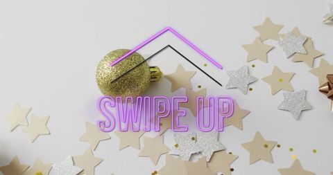 Purple neon swipe up overlay on festive flatlay featuring gold ornament and star confetti