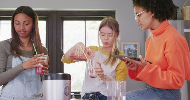 Friends Making Smoothies Together in Modern Kitchen - Download Free Stock Images Pikwizard.com