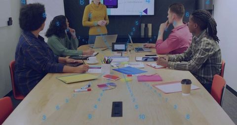 Diverse Team Holding Modern Corporate Meeting in Office Boardroom