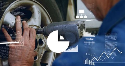 Technician tightening alloy wheel lug nuts with impact wrench, industrial data overlay