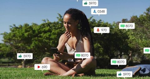 Woman Engaging with Social Media in Tranquil Park Setting