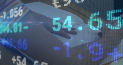 Stock Market Data Overlay with Person Writing Notes