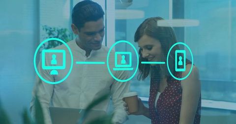 Professional Colleagues Discussing Technology and Innovation in Modern Office