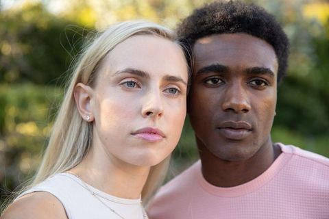 Interracial Couple Embracing Nature with Love and Elegance