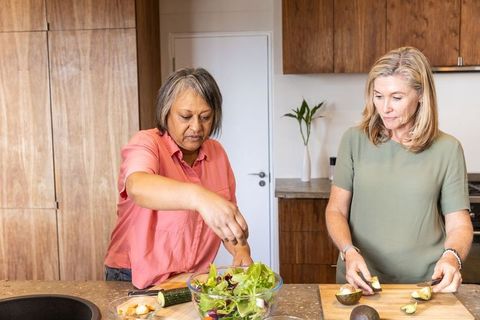 Diverse Friends Preparing Healthy Meal in Modern Kitchen