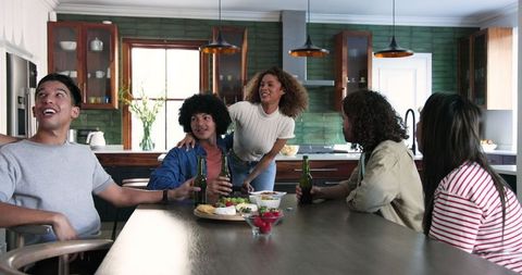 Diverse Friends Enjoying Time Together in Cozy Kitchen