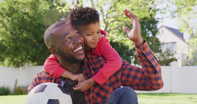 Father and Son Smiling Outdoors with Soccer Ball - Download Free Stock Images Pikwizard.com