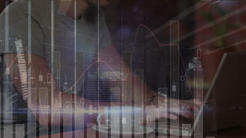 Businessman Analyzing Financial Data on Laptop at Night