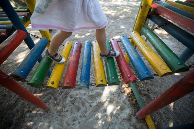 Child Walking on Colorful Jungle Gym at Playground - Download Free Stock Images Pikwizard.com