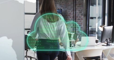 Digital Cloud Icon with Diverse Businesswomen in Modern Office